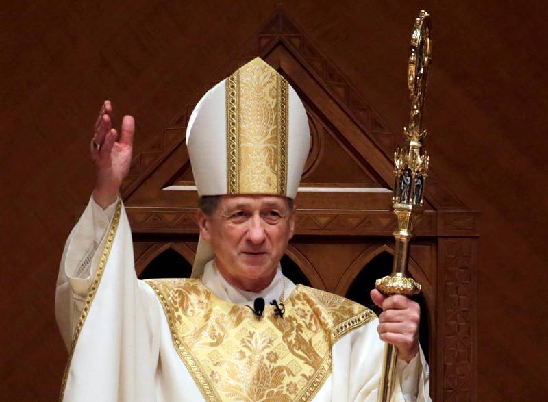 FILE - In this Nov. 18, 2014, file photo, Archbishop Blase Cupich acknowledges after the retiring Cardinal Francis George presents the crozier the during his Installation Mass at Holy Name Cathedral in Chicago. Illinois Attorney General Lisa Madigan on Wednesday, Dec. 19, 2018, issued a blistering report about clergy sexual abuse, saying that Catholic dioceses in Illinois has not released the names of at least 500 clergy accused of sexually abusing children. Cupich in a statement said that although he regretted "our failures to address the scourge of clerical sexual abuse," the archdiocese has been a leader in dealing with the issue, including a policy since 2002 of reporting "all allegations of child sexual abuse to civil authorities." (AP Photo/Charles Rex Arbogast, Pool, File)