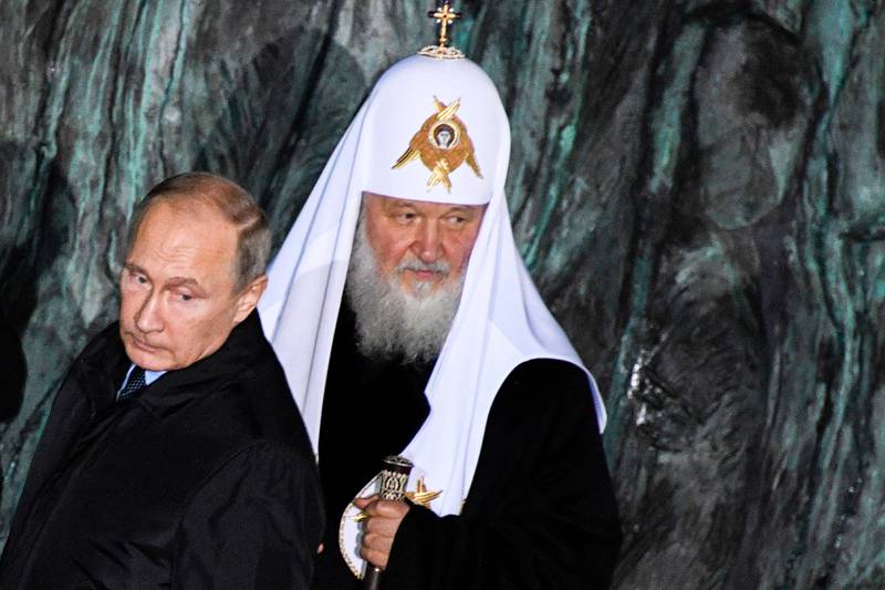 FILE In this file pool photo taken on Monday, Oct. 30, 2017, Russian President Vladimir Putin, left, and Orthodox Patriarch Kirill attend a ceremony unveiling the country's first national memorial to victims of Soviet-era political repressions called "The Wall of Grief" in Moscow, Russia. If Vladimir Putin fulfills the goals he‚Äôs set for his new six-year term as president, Russia in 2024 will be far advanced in new technologies, many of its notoriously poor roads will be improved, and its people will be living significantly longer. But there‚Äôs wide doubt about how much of that he‚Äôll achieve, if any of it. (Alexander Nemenov/Pool Photo via AP, File)