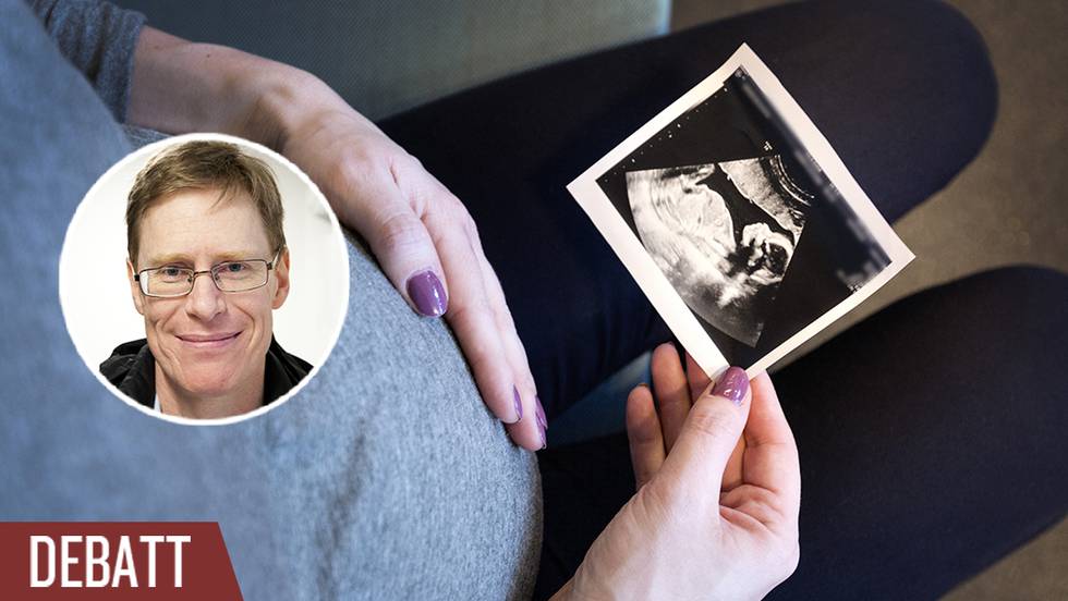 Gravid kvinna med ultraljudsbild.