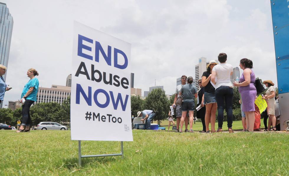 A small group of protesters fighting various forms of abuse within the church engage passersby outside at the Southern Baptist Convention meeting in Dallas, Texas, Tuesday, June 12, 2018. (Rodger Mallison/Star-Telegram via AP)