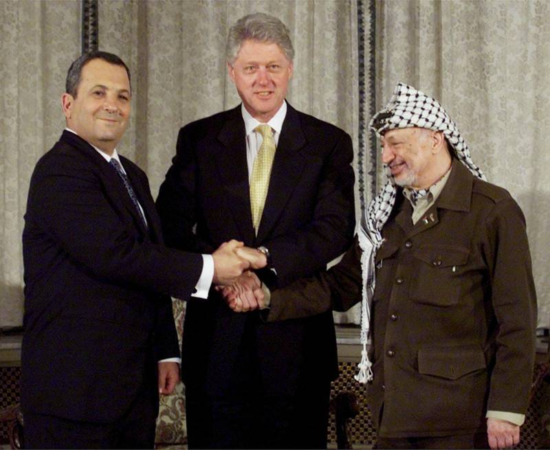 
From left, Israeli Prime Minister Ehud Barak, President Clinton and Palestinian leader Yasser Arafat, pose for photographers prior to the start of their trilateral meeting in the U.S. Embassy residence in Oslo, Norway, Tuesday, Nov. 2, 1999. In a Mideast summit that ended Tuesday night in Oslo, Barak and Arafat promised Clinton they will work hard to formulate the broad outlines of a peace treaty by Feb. 13, holding frequent one-on-one talks once they return home. (AP Photo/Khue Bui)