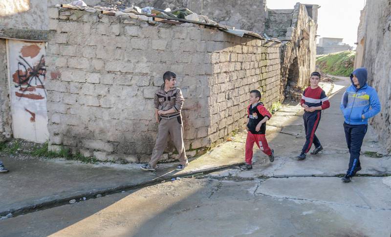 Back in the hometown. Children play again in the streets of the Christian town of Telskuf .